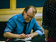 George Saunders signs books after an event.